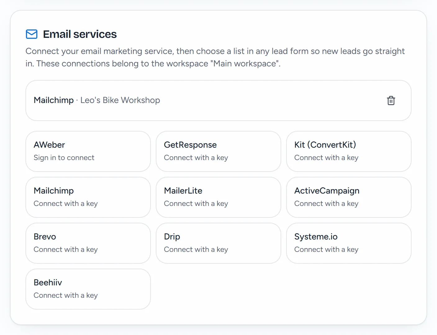 The Email services card in Settings: Mailchimp connected as Leo's Bike Workshop, and tiles for AWeber, GetResponse, Kit, Mailchimp, MailerLite, ActiveCampaign, Brevo, Drip, Systeme.io and Beehiiv.